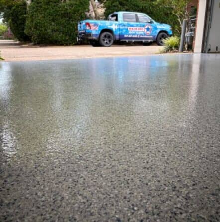 homeowner garage with new tidal wave epoxy flake flooring installed