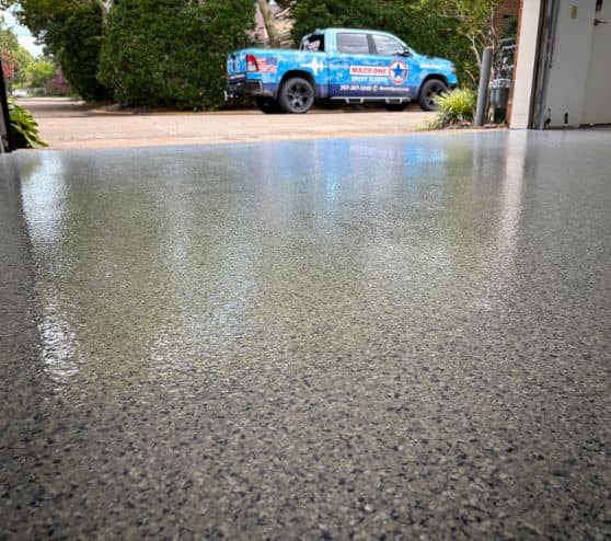 homeowner garage with new tidal wave epoxy flake flooring installed