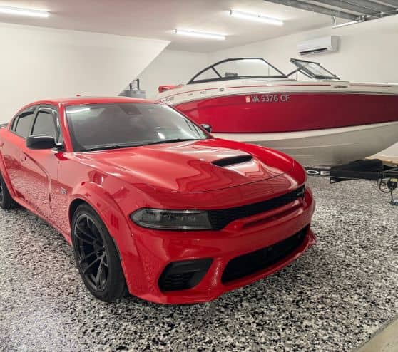 dodge charger and boat sitting on new epoxy flooring