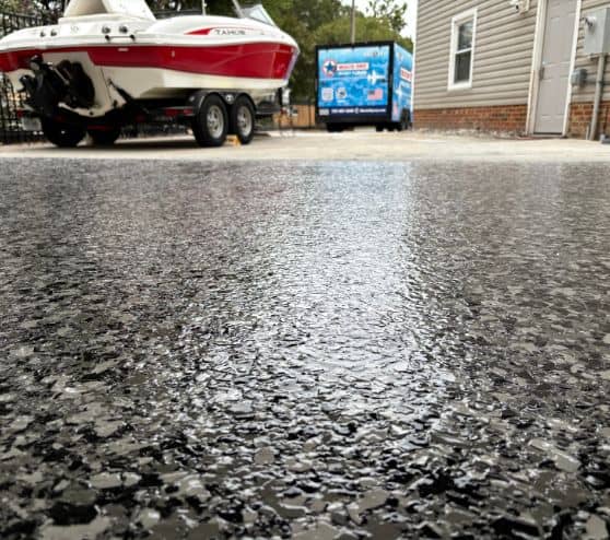 close-up of tuxedo epoxy flake flooring for homeowner garage