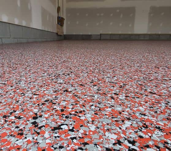 close-up of red epoxy flake flooring for homeowner