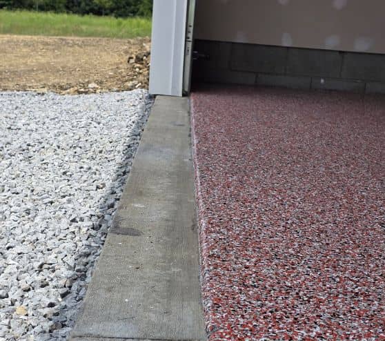 close-up of red epoxy flake flooring for homeowner garage