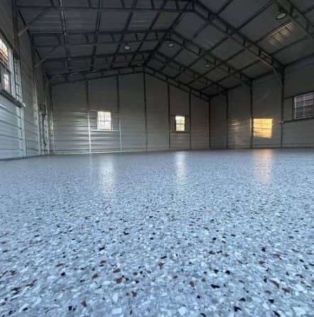 close-up of outback epoxy flake flooring installed for homeowner warehouse