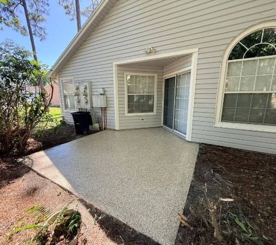 homeowner back patio with new epoxy flooring installed