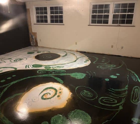 homeowner garage with new solid epoxy flooring installed