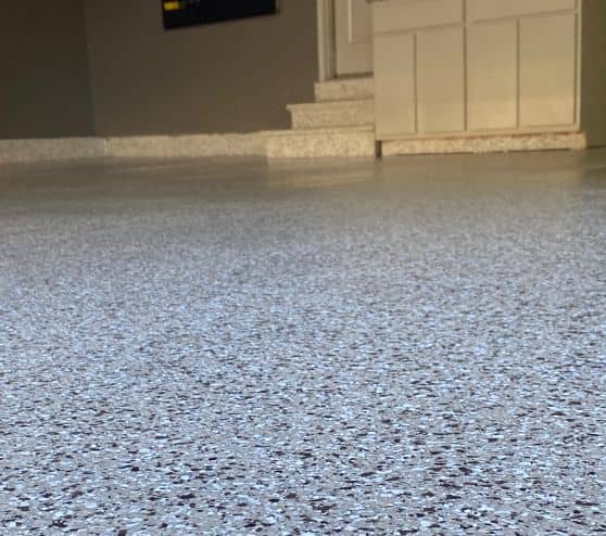 close-up of cottonwood epoxy flake flooring for homeowner garage