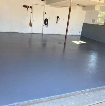 homeowner garage with solid epoxy flooring installed
