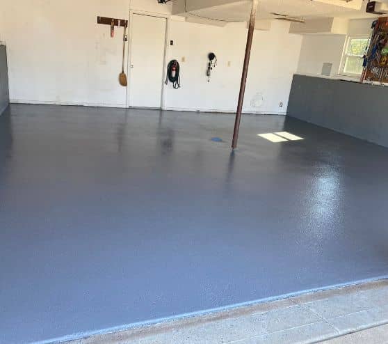 homeowner garage with solid epoxy flooring installed