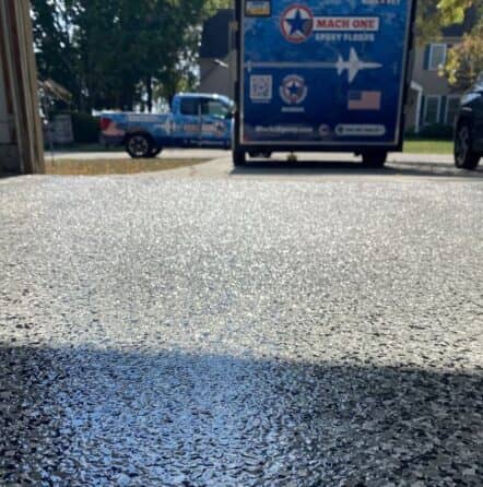 close-up of whisper grey epoxy flake flooring installed for homeowner garage
