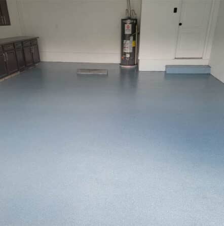homeowner garage with blue epoxy flake flooring