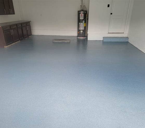 homeowner garage with blue epoxy flake flooring