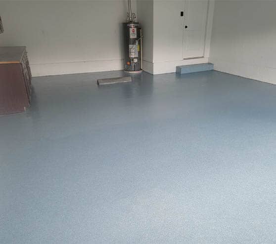 homeowner garage with blue epoxy flake flooring