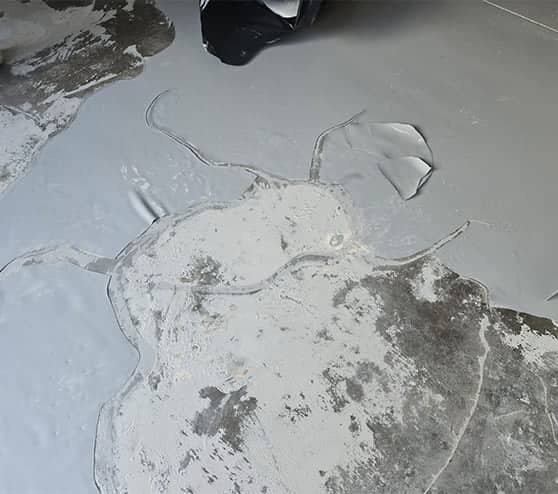 close-up of garage floor peeling