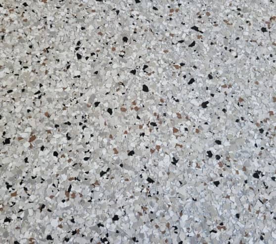 close view of dakota grey epoxy flake flooring