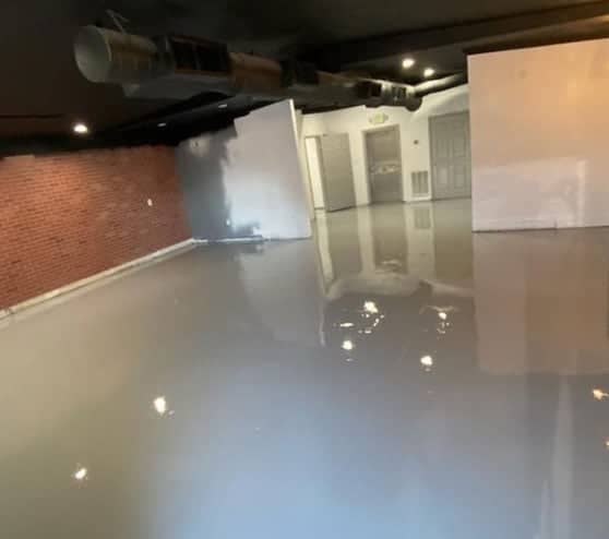 completed epoxy flake flooring installation for tampa smoke shop
