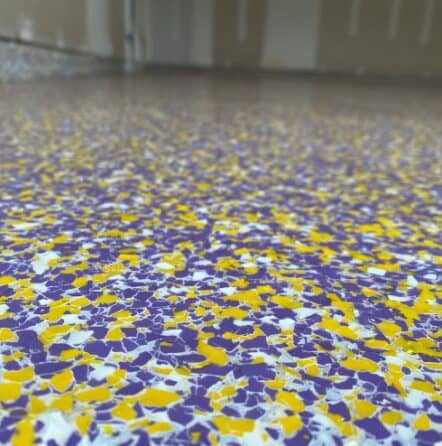 close-up of Minnesota Vikings color epoxy flake flooring for homeowner garage