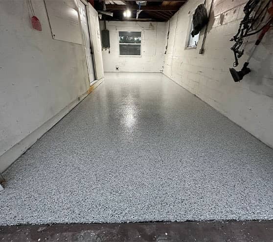 homeowner garage with new epoxy flooring installed