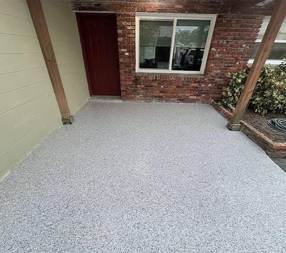homeowner patio with new epoxy flake flooring installed