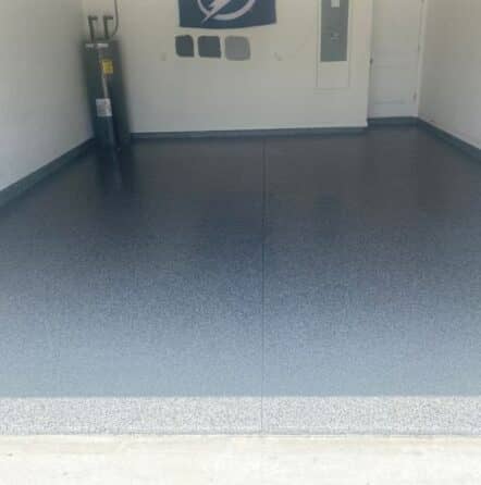 homeowner garage with new epoxy flooring installed front view
