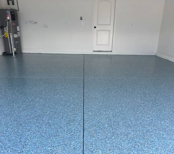 homeowner garage with blue epoxy flake flooring