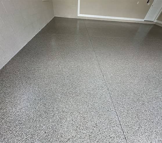 close-up of epoxy flake flooring in garage for homeowner