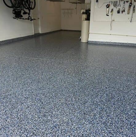 blue epoxy flake flooring in garage at residential home