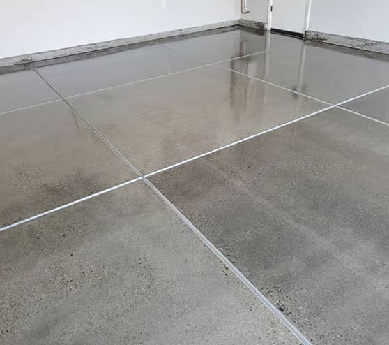 garage flooring in need of concrete refinishing services
