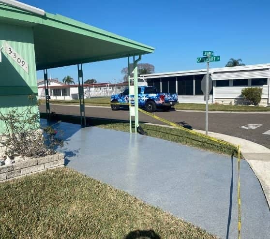 homeowner driveway with Grey Epoxy Flake Flooring installed