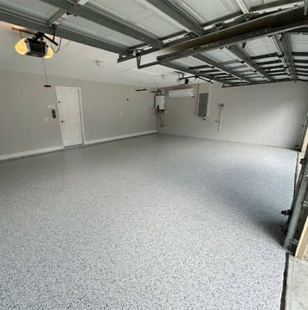 homeowner garage with fresh poured epoxy flake flooring