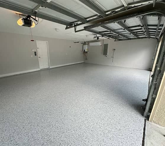 homeowner garage with fresh poured epoxy flake flooring
