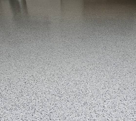 close-up epoxy flake flooring in garage