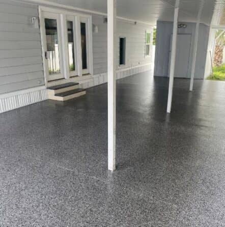 homeowner patio in florida with new gray epoxy flake flooring installed