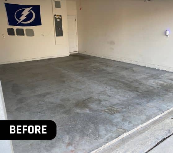side angle of homeowner garage with old concrete