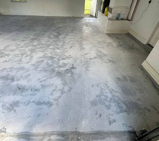 homeowner garage before new flooring