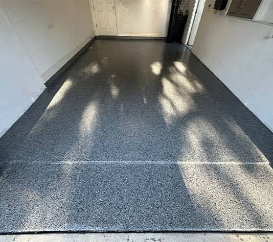 homeowner garage with freshly poured nightfall flake epoxy flooring
