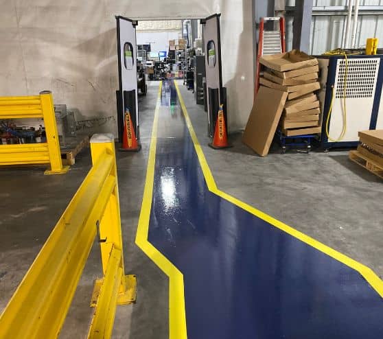 blue and yellow line markings for TMF Plastic Solutions warehouse