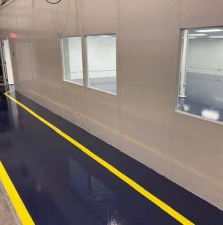 TMF Plastics warehouse with new blue solid epoxy flooring installed