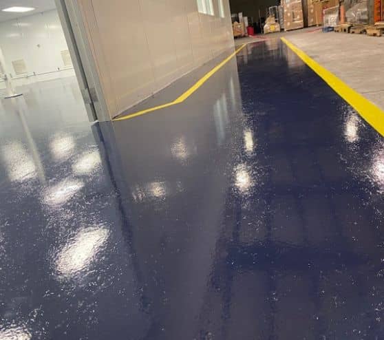TMF Plastics warehouse with blue solid epoxy flooring
