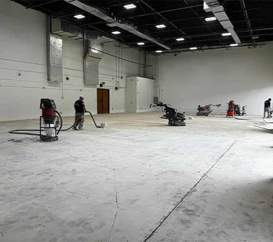 multiple gentleman repairing concrete for commercial property