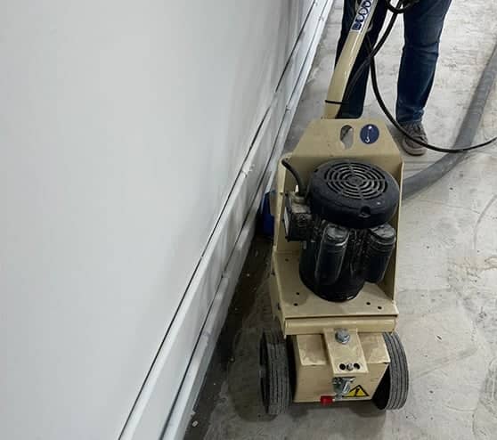 close-up of machine fixing concrete
