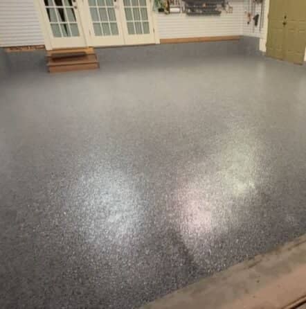 homeowner garage with new epoxy flooring installed