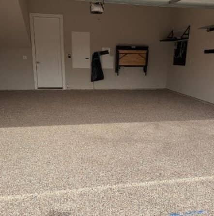 front view of homeowner garage with new epoxy flooring installed after portrait