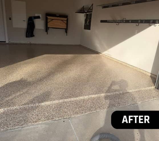 homeowner garage with new epoxy flooring installed after portrait