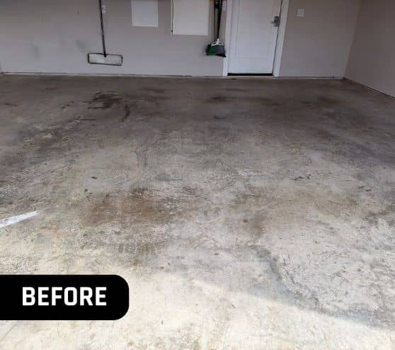 front view of homeowner garage with old concrete flooring before portrait