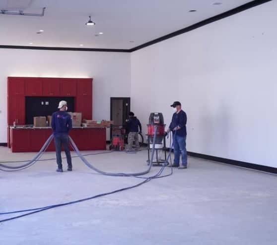 the MACH ONE team working in a garage