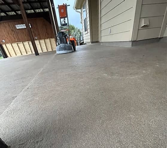 close-up of machine on patio sealing concrete