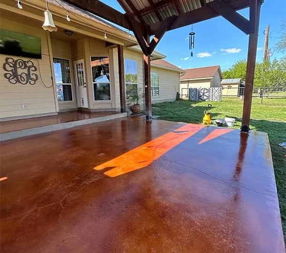 back yard patio with new seal concrete