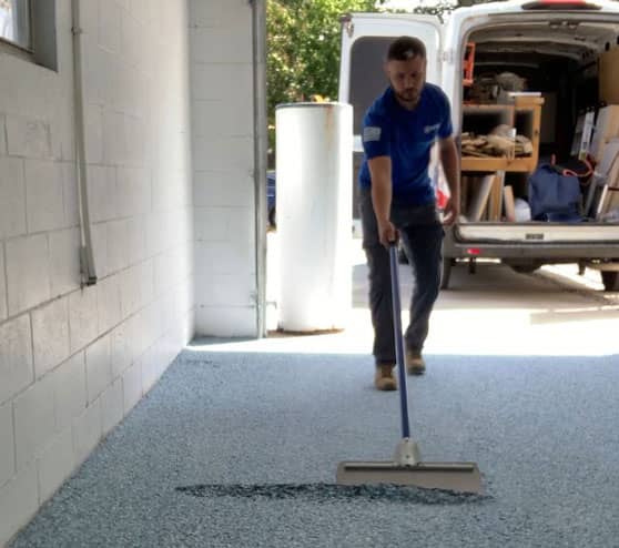an employee installing epoxy in Orlando, FL