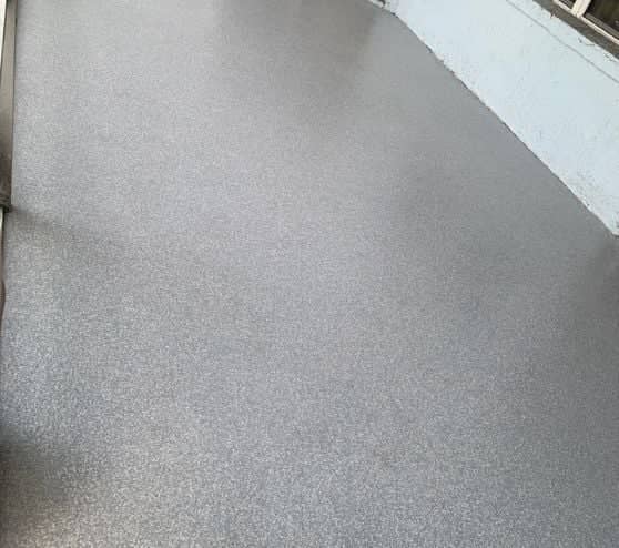 jays back patio with epoxy flake flooring installed
