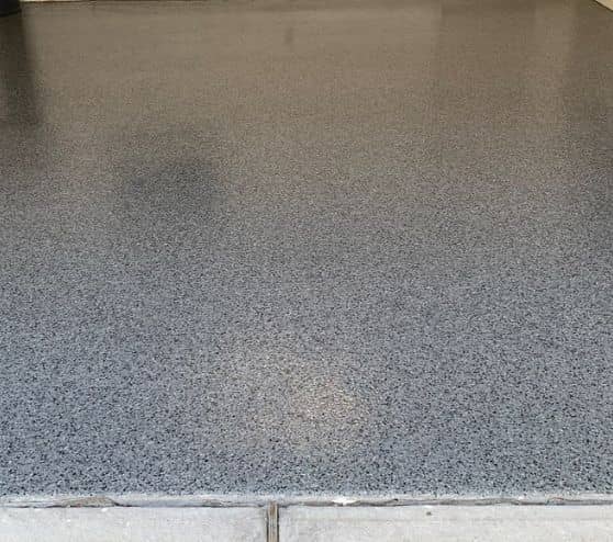 close-up of new epoxy flake flooring for drew garage
